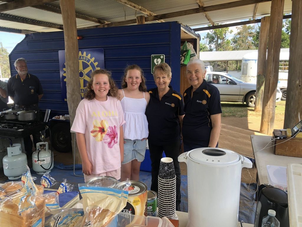 Four Uralla Rotarians standing together smiling